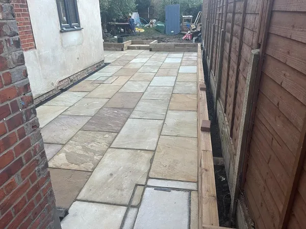 Riven slab path with a step along a side passage